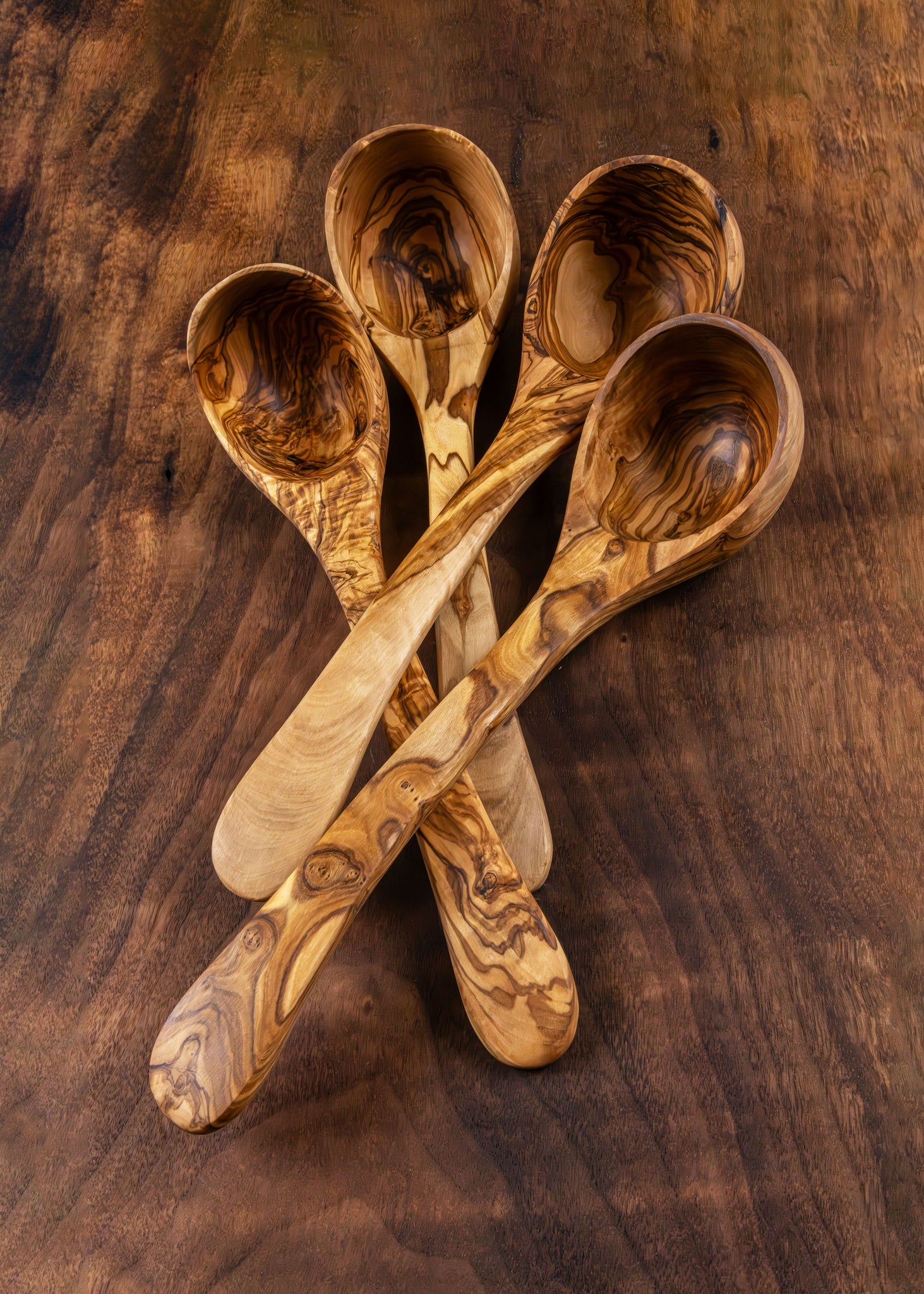 Set of wooden spoons on a wooden surface